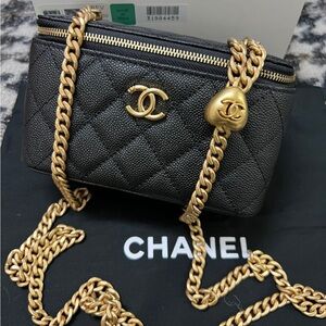 CHANEL Black and Gold Quilted Bag